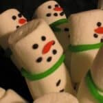 Close-up view of Snowman Marshmallow Buddies with green scarves