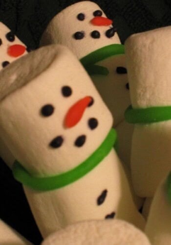 Close-up view of Snowman Marshmallow Buddies with green scarves