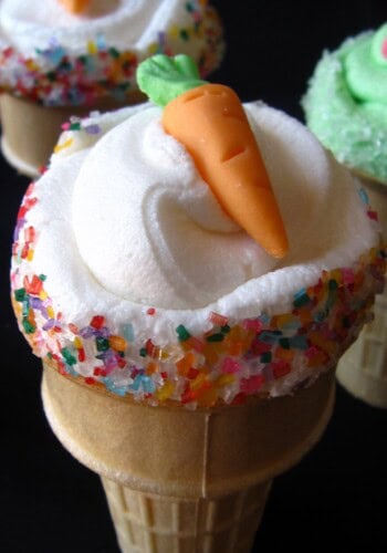 Overhead view of a cupcake in an ice cream cone with a carrot decoration on top