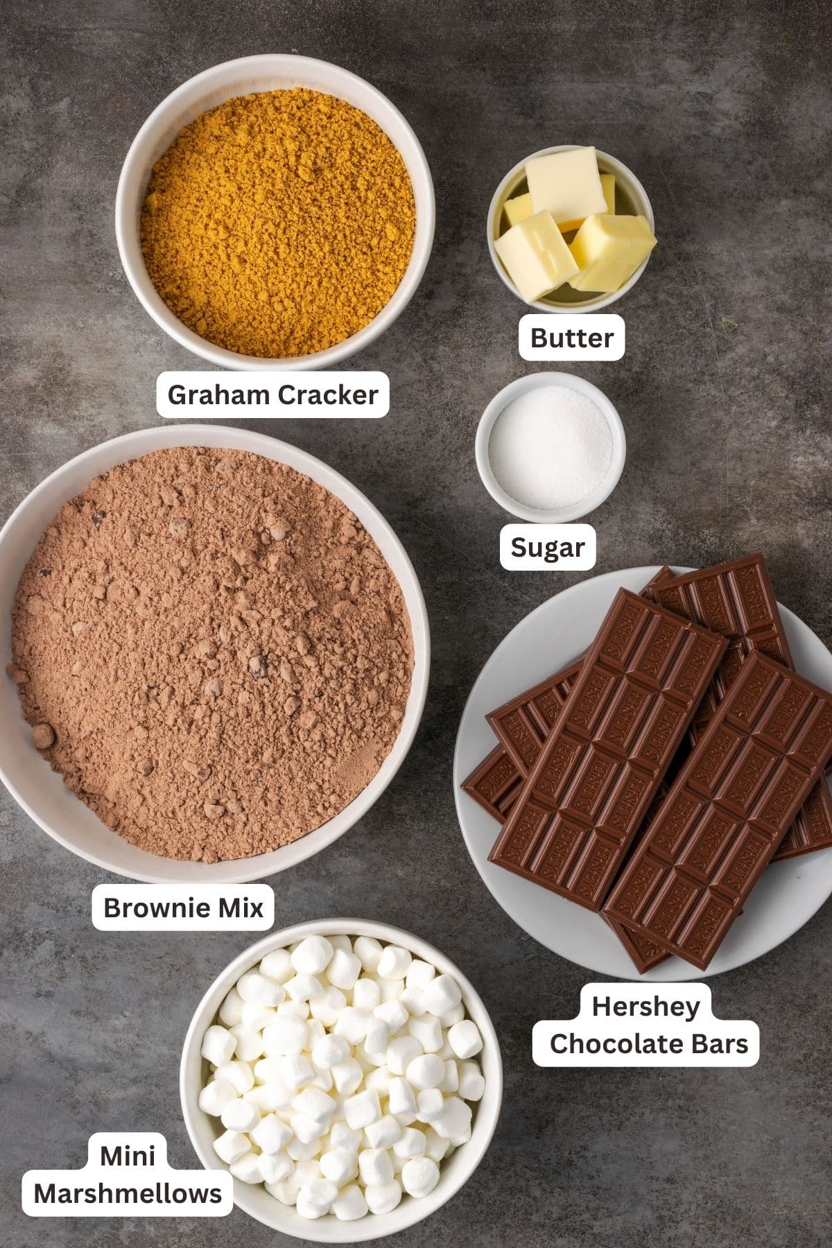 Ingredients for smores brownies with text labels overlaying each ingredient.