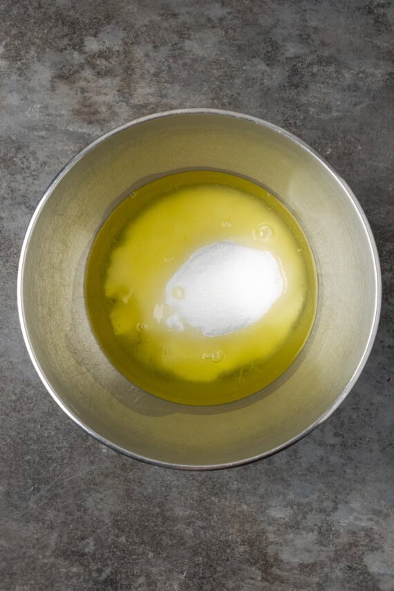 Egg whites and sugar combined in a bowl.