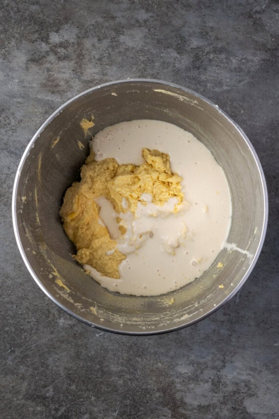 Cake batter ingredients combined in a metal mixing bowl.
