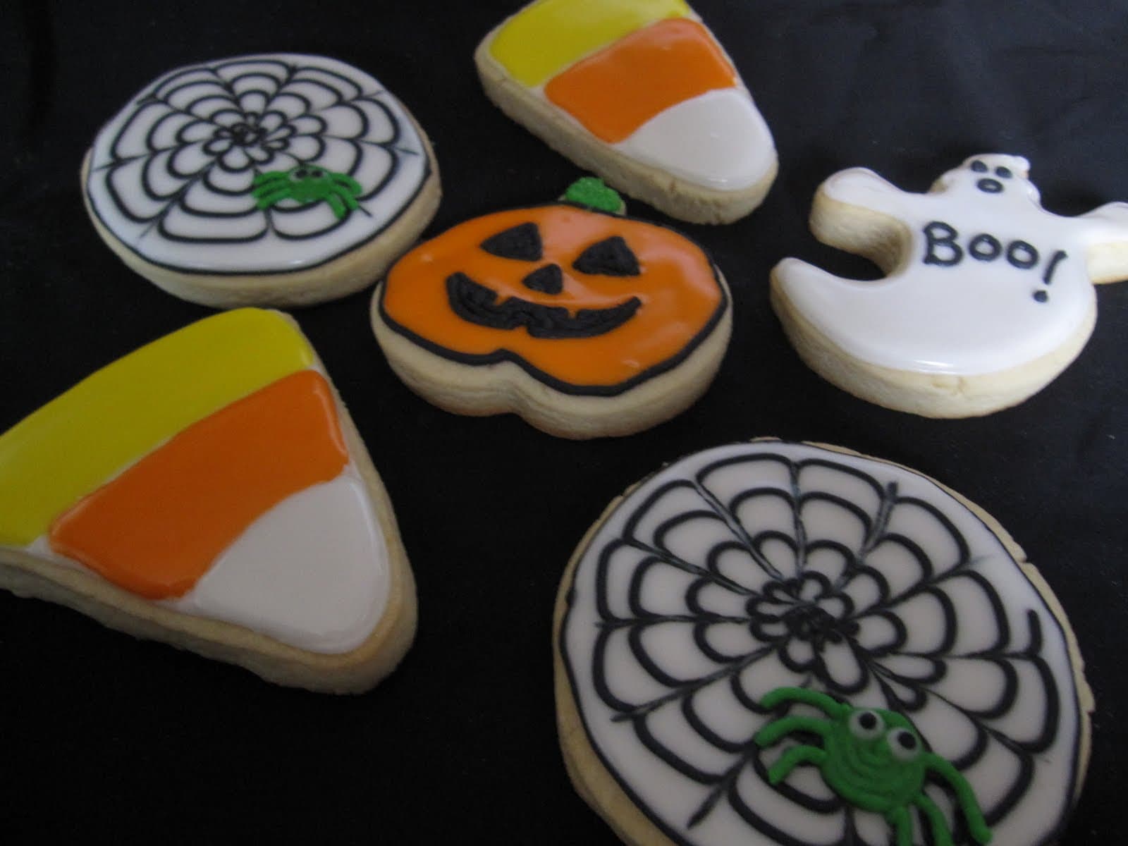 A variety of frosted Halloween-themed cookies