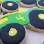 Overhead view of tractor decorated cookies with the number 4 on them