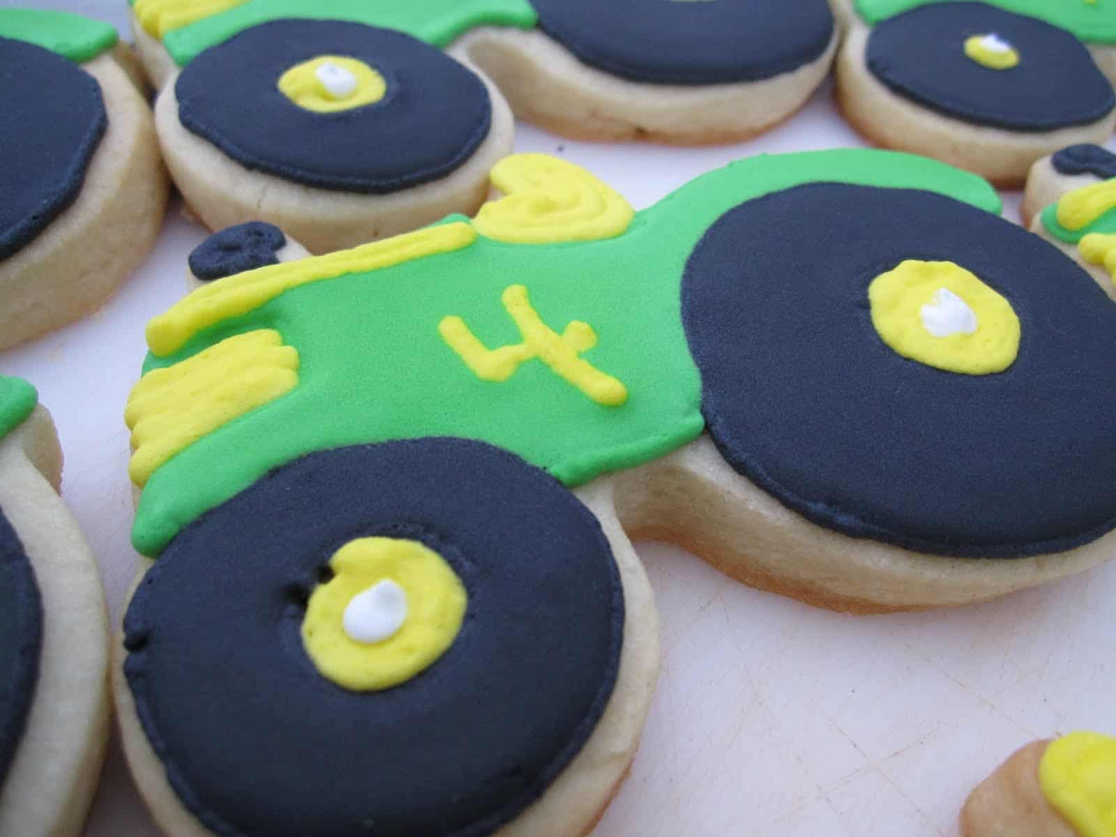Overhead view of tractor decorated cookies with the number 4 on them