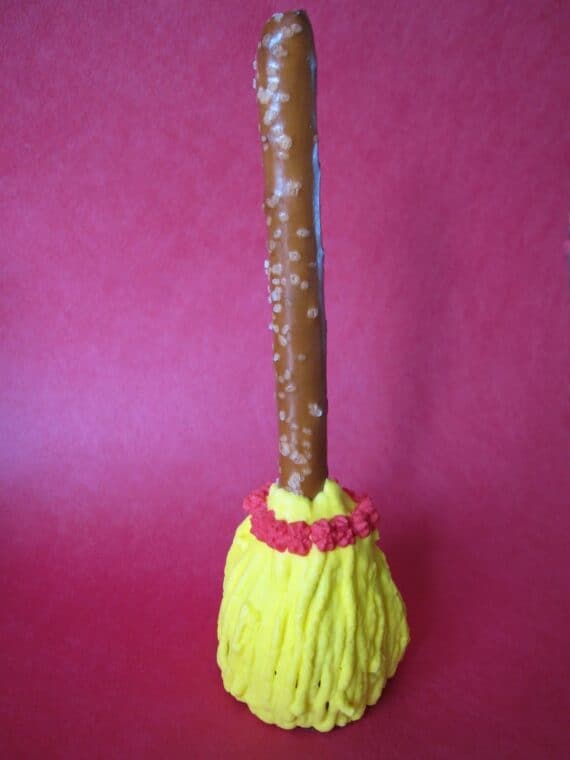 Oreo Truffle Witch's Broom with yellow icing bristles.