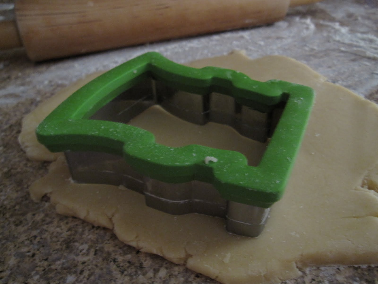 Frankenstein cookie cutter on rolled-out dough