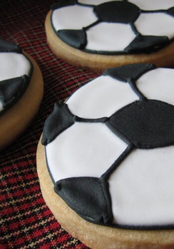 Close-up of cookies decorated like soccer balls