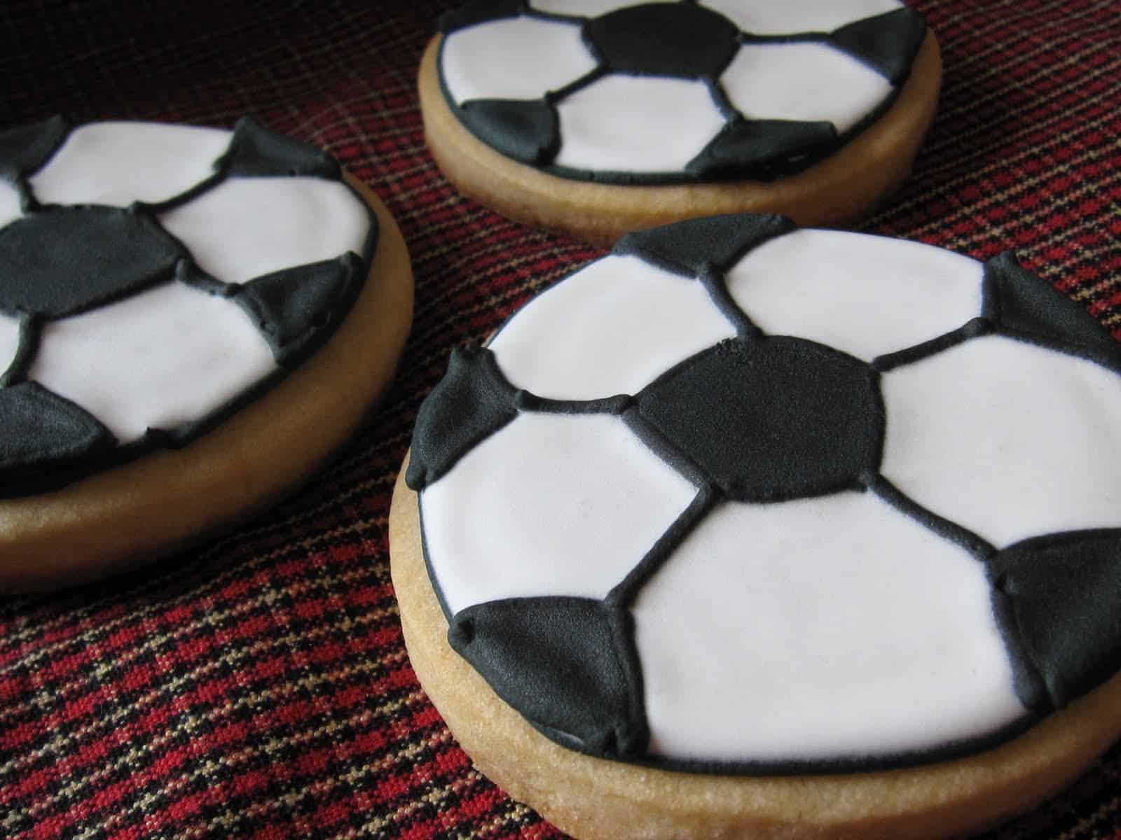 Close-up of cookies decorated like soccer balls