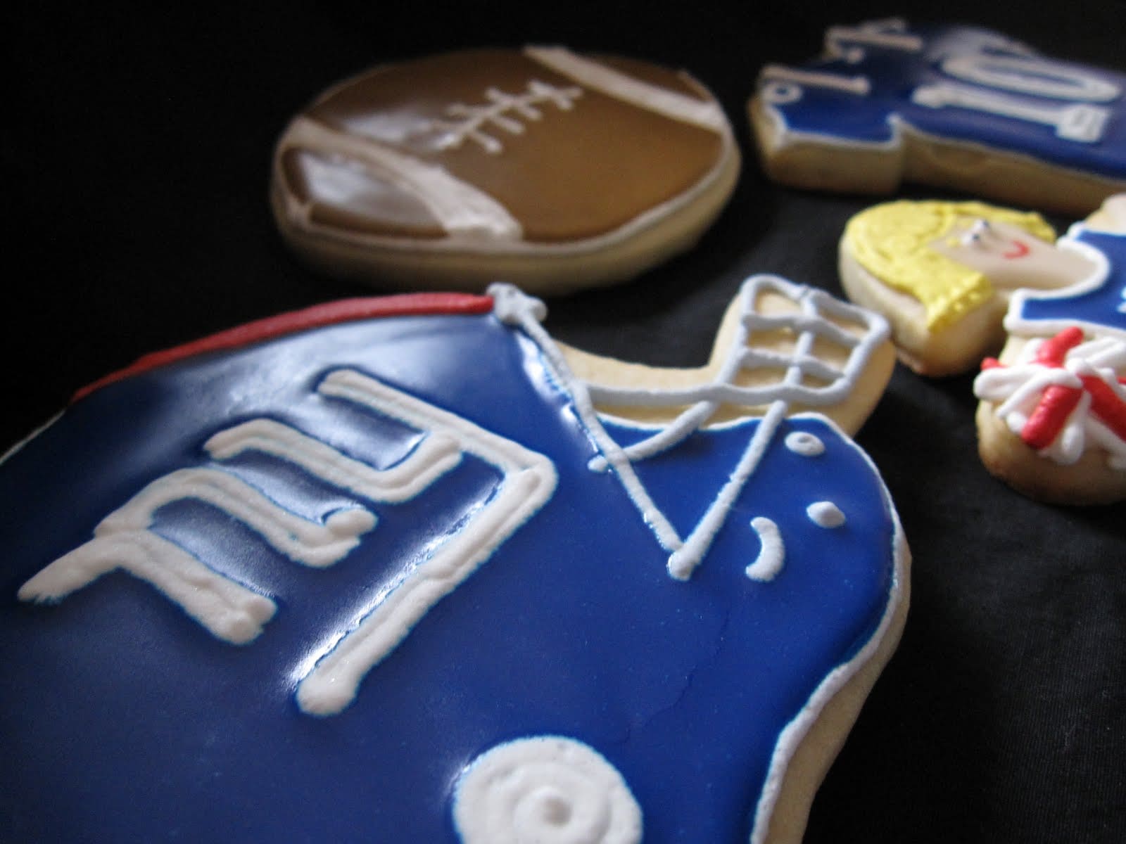 NY Giants themed cookies with helmet, football, jersey and cheerleader