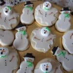 Overhead view of cookies decorated as melting snowmen