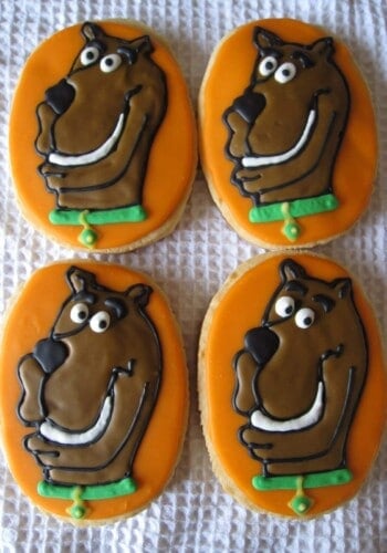 Overhead view of four Scooby Doo decorated cookies