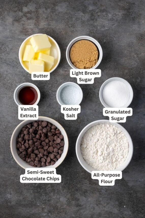 Chocolate chip cookie dough ingredients with text labels overlaying each ingredient.