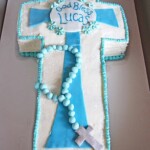 A Blue and White Communion Cake in a Gray Cardboard Box