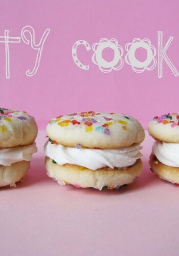Three vanilla sandwich Party Cookies in a row