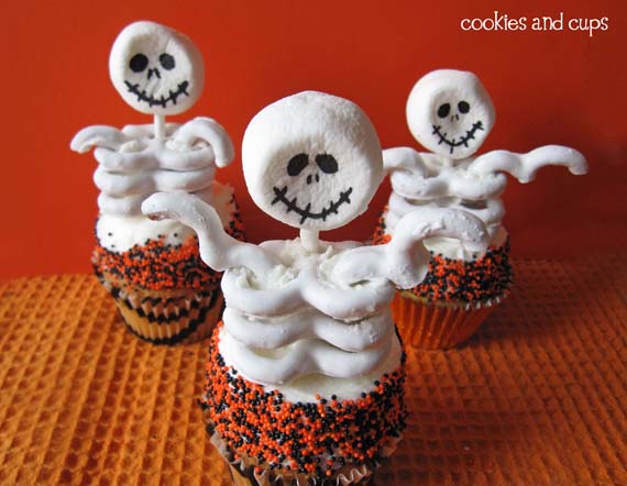 3 cupcakes with skeleton toppers