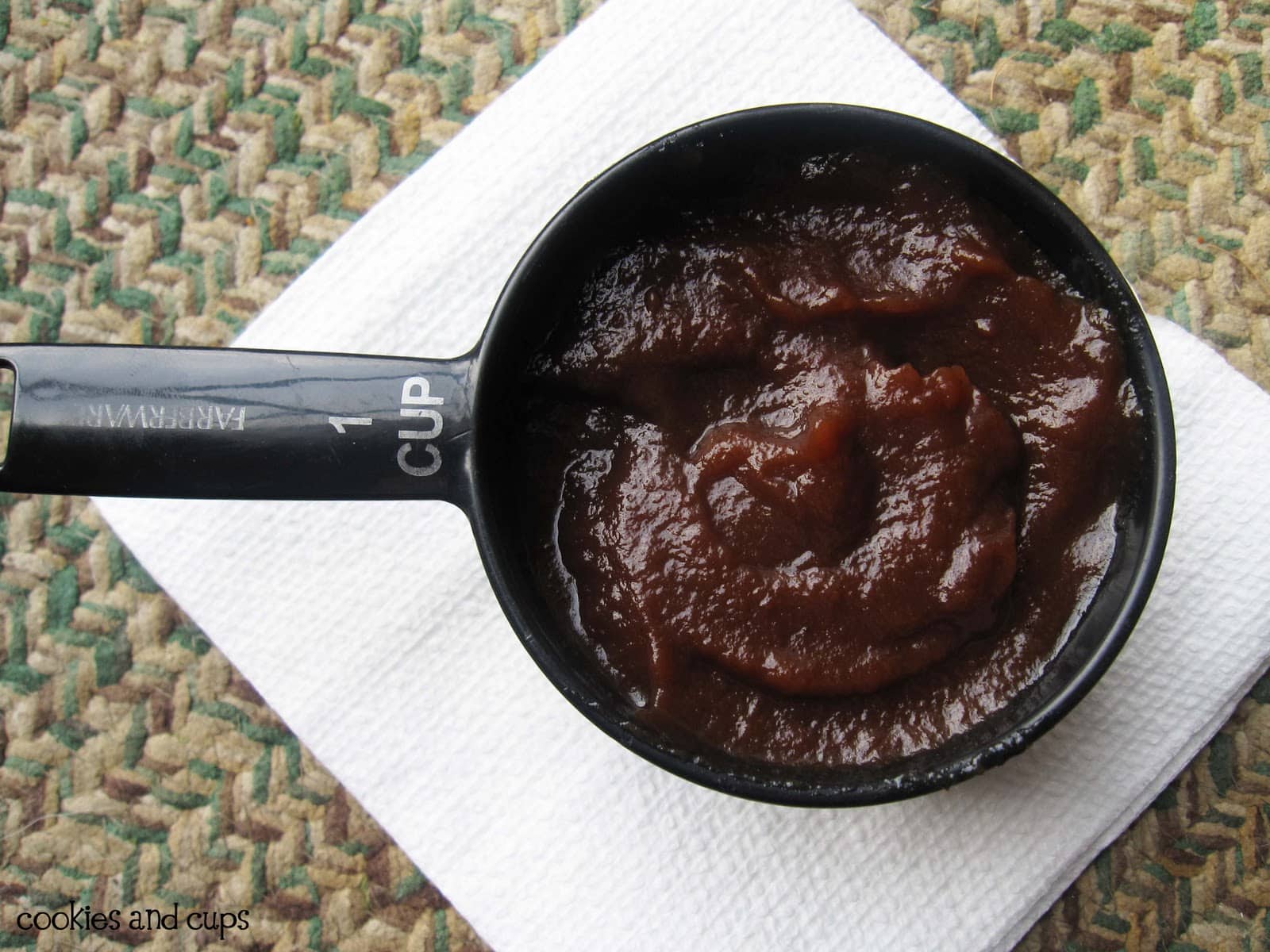 Apple butter in a measuring cup