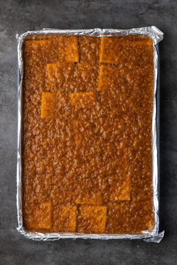 Baked saltine toffee in a baking sheet.