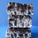 Three Squares of Cookies and Cream Fudge Stacked on Top of One Another