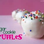 Close-up of white chocolate coated sugar cookie truffles with rainbow sprinkles on top