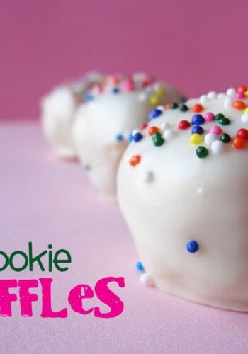 Close-up of white chocolate coated sugar cookie truffles with rainbow sprinkles on top