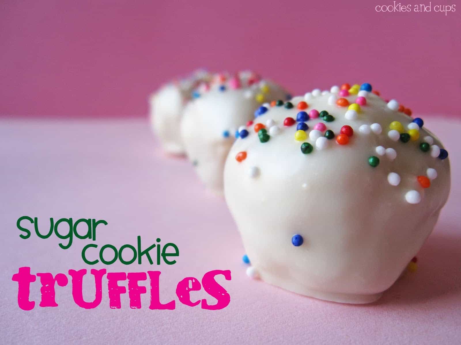 Close-up of white chocolate coated sugar cookie truffles with rainbow sprinkles on top