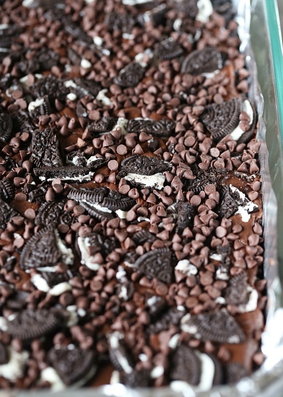 Triple Chocolate Oreo Bars...A creamy fudge layer that sits on top of a crunchy Oreo crust, topped with chocolate chips, MORE Oreos and white chocolate!