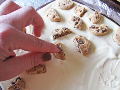 An Index Finger Pressing Chips Ahoy Cookies into the White Chocolate Spread