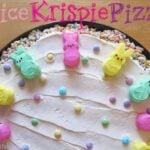 Overhead view of a Rice Krispie Pizza decorated with colorful marshmallow bunnies and sprinkles