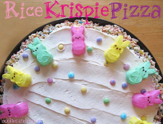 Overhead view of a Rice Krispie Pizza decorated with colorful marshmallow bunnies and sprinkles