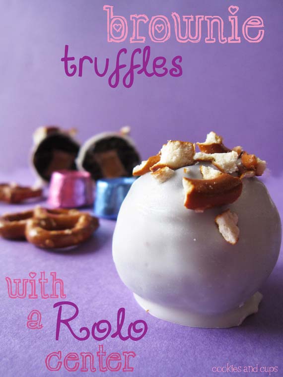 Close-up of a white chocolate dipped brownie truffle topped with pretzel pieces