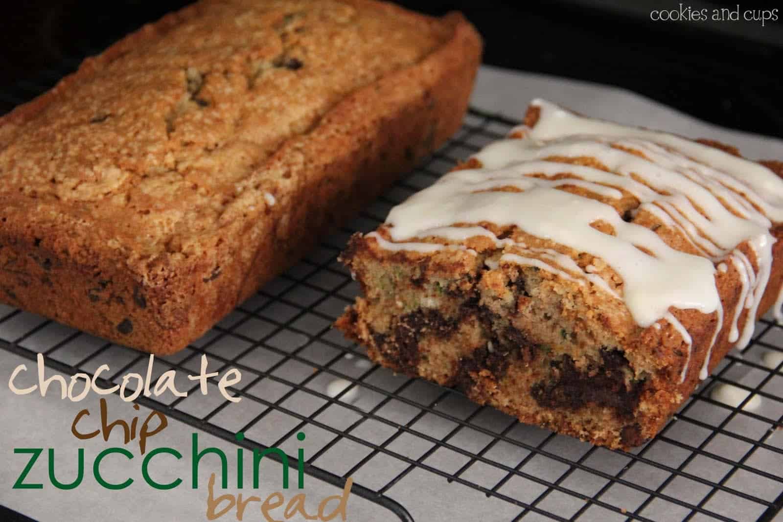 Two loaves of chocolate chip zucchini bread on a cooling rack