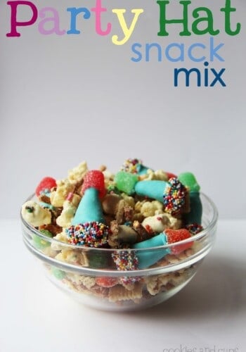 Party hat snack mix in a clear glass bowl