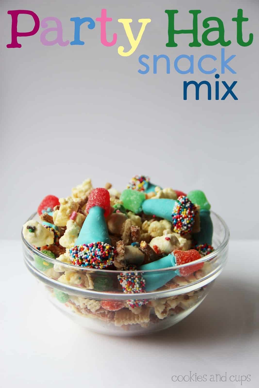 Party hat snack mix in a clear glass bowl