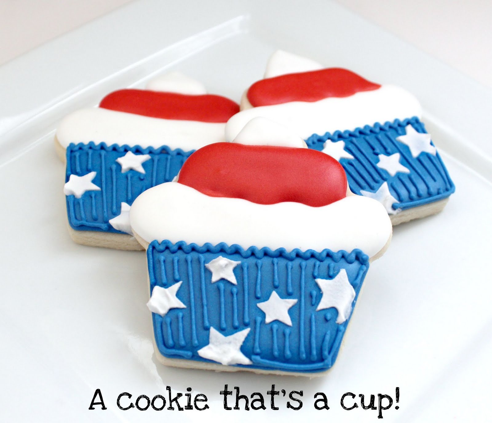 3 stars and stripes cupcake cookies stacked on a plate
