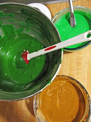 Overhead view of three bowls of batter in camo colors