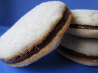 Close-up of a vanilla sandwich cookie with chocolate filling