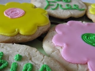 Eggless sugar cookies decorated to look like flowers.