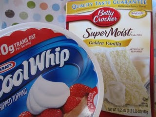 A tub of cool whip next to a box of vanilla cake mix.