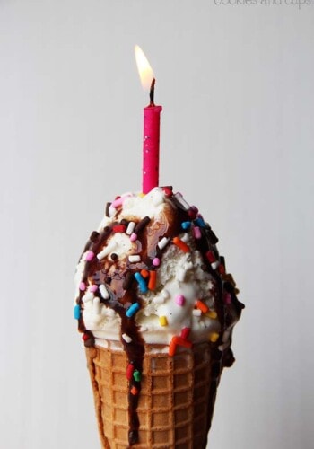 Close-up of a birthday ice cream cone with a candle