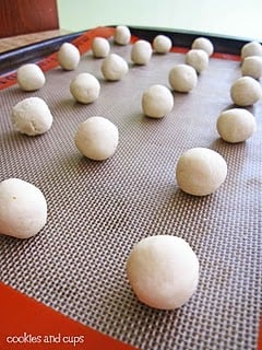 Meltaway cookie dough balls on a baking sheet.