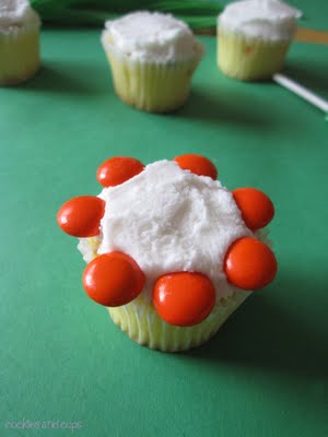 M&M candies on a vanilla frosted cupcake