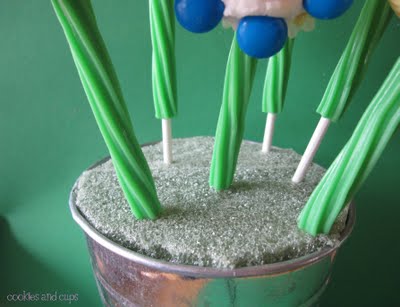 Green twizzler flower stems stuck into foam