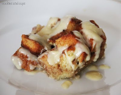 A serving of French Toast Stick Bread Pudding on a plate with glaze