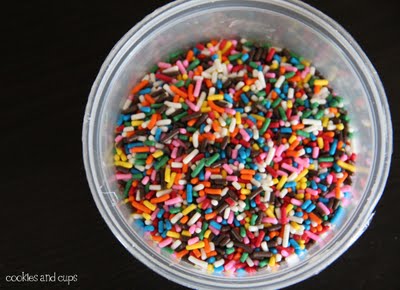 Overhead view of a container of rainbow sprinkles