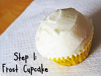 A vanilla frosted cupcake showing Step 1