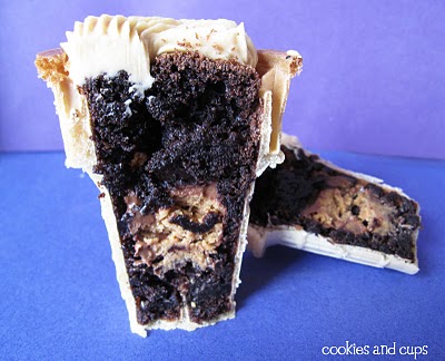 A halved peanut butter brownie filled ice cream cone to show the inside