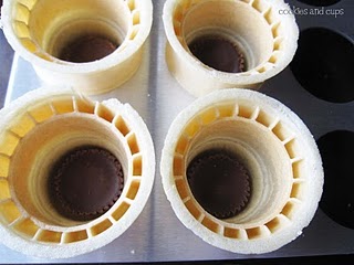 Overhead view of ice cream cones with a mini peanut butter cup inside
