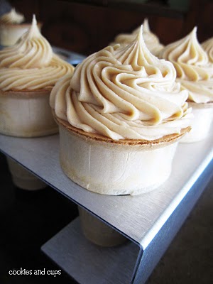 Ice cream cones topped with peanut butter frosting