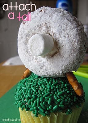A Sheep Cupcake Topper on a Cupcake with a Mini Marshmallow Tail